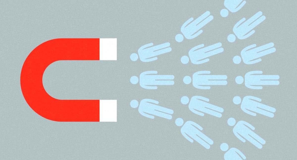 En magnet som drar till sig flera stiliserade människosymboler